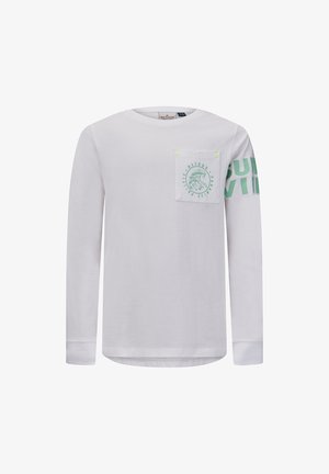 Camisa blanca de manga larga con bolsillo en el pecho delantero que presenta un gráfico de ola y el texto "Retour Paradise Pacific"; texto verde "SURVIV" parcialmente en la manga derecha.