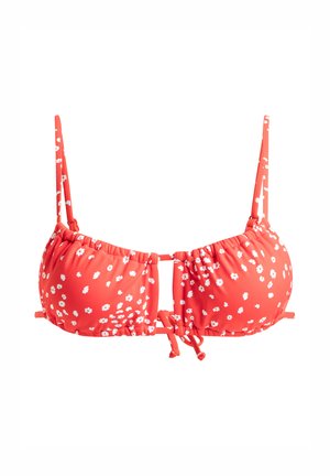 Červený bikiny top z hladkého materiálu, s bielymi kvetinovými vzormi. Nastaviteľné popruhy a šnurovanie na prednej a bočných stranách pre prispôsobenie. 