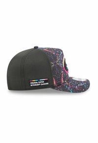 Black cap with a patterned brim, featuring colorful splatter designs. A tag reads "CRUCIAL CATCH INTERCEPT CANCER" on the side.