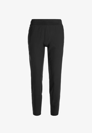 Black tapered pants in stretchy fabric, featuring an elastic waistband and a smooth texture, with no visible pockets or embellishments.