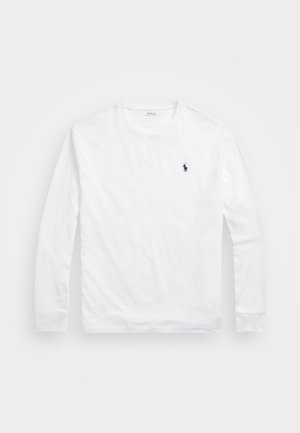 Maglietta a maniche lunghe bianca in cotone, con scollo rotondo e un piccolo logo polo blu navale sul lato sinistro del petto. Texture liscia.