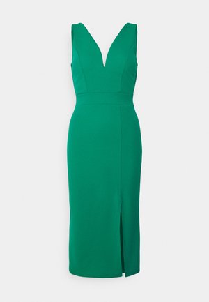 Vestido verde justo com um decote em V profundo, design sem mangas, até aos joelhos, e uma abertura lateral. Feito de um tecido suave com uma cor sólida.