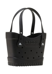 Bolsa de tote de goma negra con dos asas, que cuenta con agujeros de ventilación, logo en relieve y base texturizada para un mejor agarre.