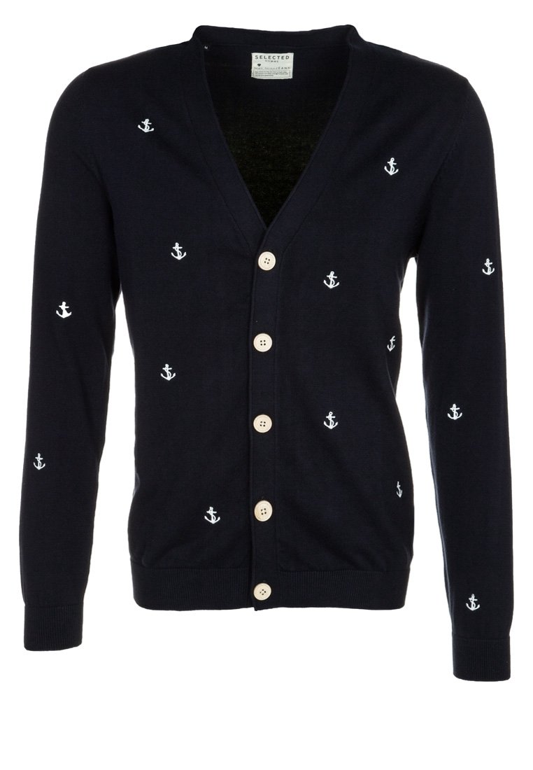 Námořnický kardigan s bílou výšivkou kotvy, výstřihem do V, pěti dřevěnými knoflíky, žebrovanými rukávy a lemem. Měkká pletená látka.