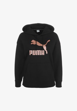 Sweat à capuche noir avec poche avant et logo Puma couleur or rose ainsi que texte sur la poitrine.