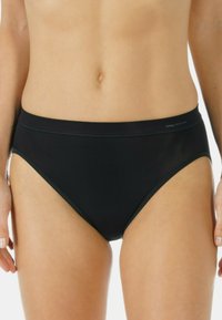 Black women's hipster underwear made of soft fabric, featuring a smooth waistband and minimal stitching details, providing a seamless look.