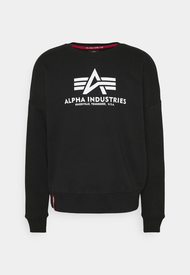 Sweat-shirt noir à manches longues avec logo blanc Alpha Industries et texte "Knoxville, Tennessee, U.S.A." centré sur la poitrine.