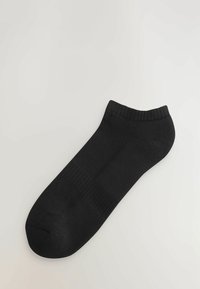 Calzino ankle in cotone nero con orlo a coste, texture liscia, punta arrotondata e senza motivi o loghi visibili.
