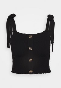 Top corto negro con textura smock, con tirantes ajustables, un cierre frontal con botones metálicos grandes y un dobladillo con forma de onda.