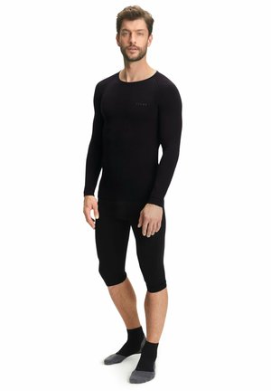 Long-sleeve black thermal top and knee-length bottoms, made of smooth, stretchy material. Features a round neck and fitted design.