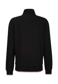 Zwarte sweatshirt met een hoge kraag en geribde manchetten. Heeft een contrasterende gestreepte zoom in rood, groen en wit. Soepele textuur.