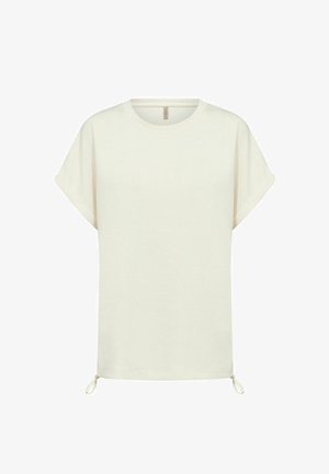 Krémovo-biele tričko s krátkym rukávom, s nohavicami zrolovanými na koncoch a nastaviteľnými šnúrkami na spodnom okraji, zobrazené na bielom pozadí.