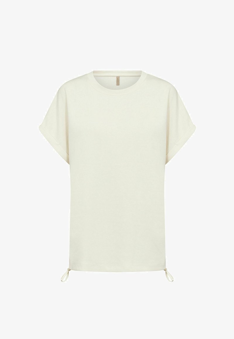 T-shirt à manches courtes couleur blanc cassé avec revers roulés et cordons réglables à la base, présenté sur un fond blanc.