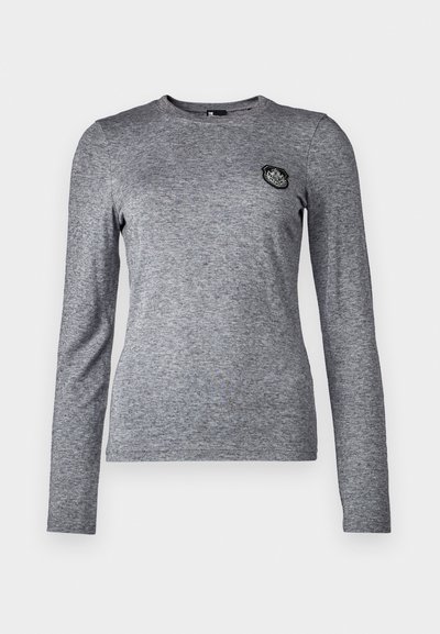 Long-sleeve gray t-shirt made of soft fabric with a round neckline and a small black patch accent on the left chest area.
