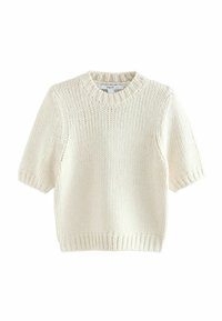 Kremowy sweter z dzianiny z krótkimi rękawami, ribbowanym dekoltem i dolną krawędzią, o luźnym kroju i grubej strukturze włóczki. Metka przymocowana przy dekolcie.