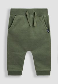 Groene katoenen joggerbroeken met een elastische tailleband, trekkoord, zijzakken en omgeslagen enkels. Voorzien van een klein merklabel op de zak.