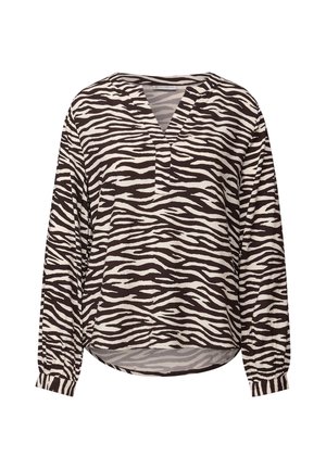 Blouse à manches longues en motif zèbre noir et blanc, avec un décolleté en V, une coupe décontractée et des poignets froncés pour ajouter de la texture.