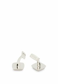 Silver cufflinks with a sleek, curved design. Square base and upright tabs feature engraved logo. Smooth, shiny metal finish throughout.