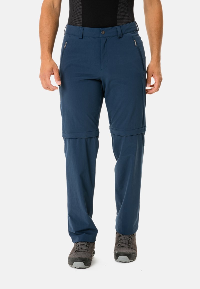 Pantaloni da trekking navy blu con zip rimovibile, realizzati in tessuto leggero. Presentano due tasche con zip e polsini regolabili. Design resistente per l'uso all'aperto.