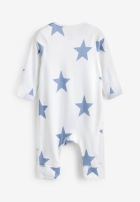 Body a maniche lunghe per neonati in cotone bianco con un ampio motivo blu di stelle. Presenta una chiusura a pressione sul fondo e una consistenza morbida.