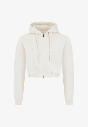 Hoodie zippé cropped en tissu crème avec capuche à cordon, poignets et taille côtelés, présentant des coutures texturées et un logo subtil.