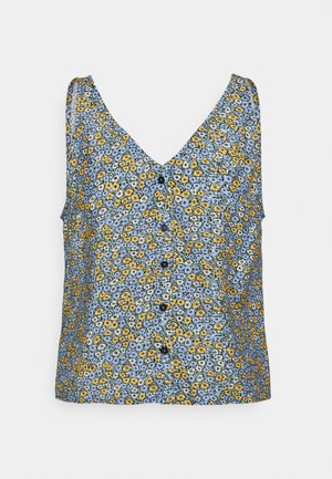 Blouse sans manches à col en V avec boutons sur le devant, présentant un petit motif floral en bleu, jaune et blanc sur un fond clair.