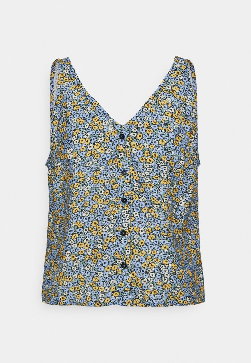 Blouse sans manches à col en V avec boutons sur le devant, présentant un petit motif floral en bleu, jaune et blanc sur un fond clair.