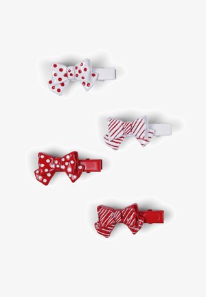 Set di quattro fermagli per capelli a forma di fiocchi, con schemi di colori rosso e bianco, pois e motivi a righe. Realizzati in plastica lucida.