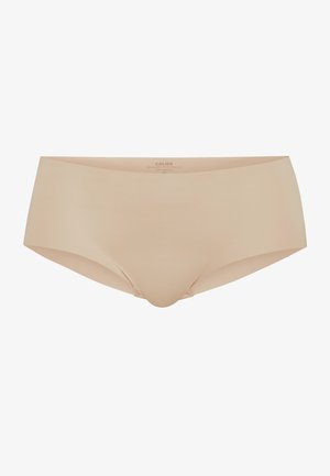Beige Damenbrief aus glattem Material. Mit einem tief sitzenden Bund und nahtlosen Kanten für eine schlanke Optik. Keine sichtbaren Hardware-Elemente oder Muster.