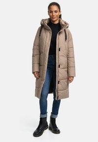 Long beige puffer coat with a hood, featuring a front zipper and snap button closure, quilted texture, and accents of black hardware.