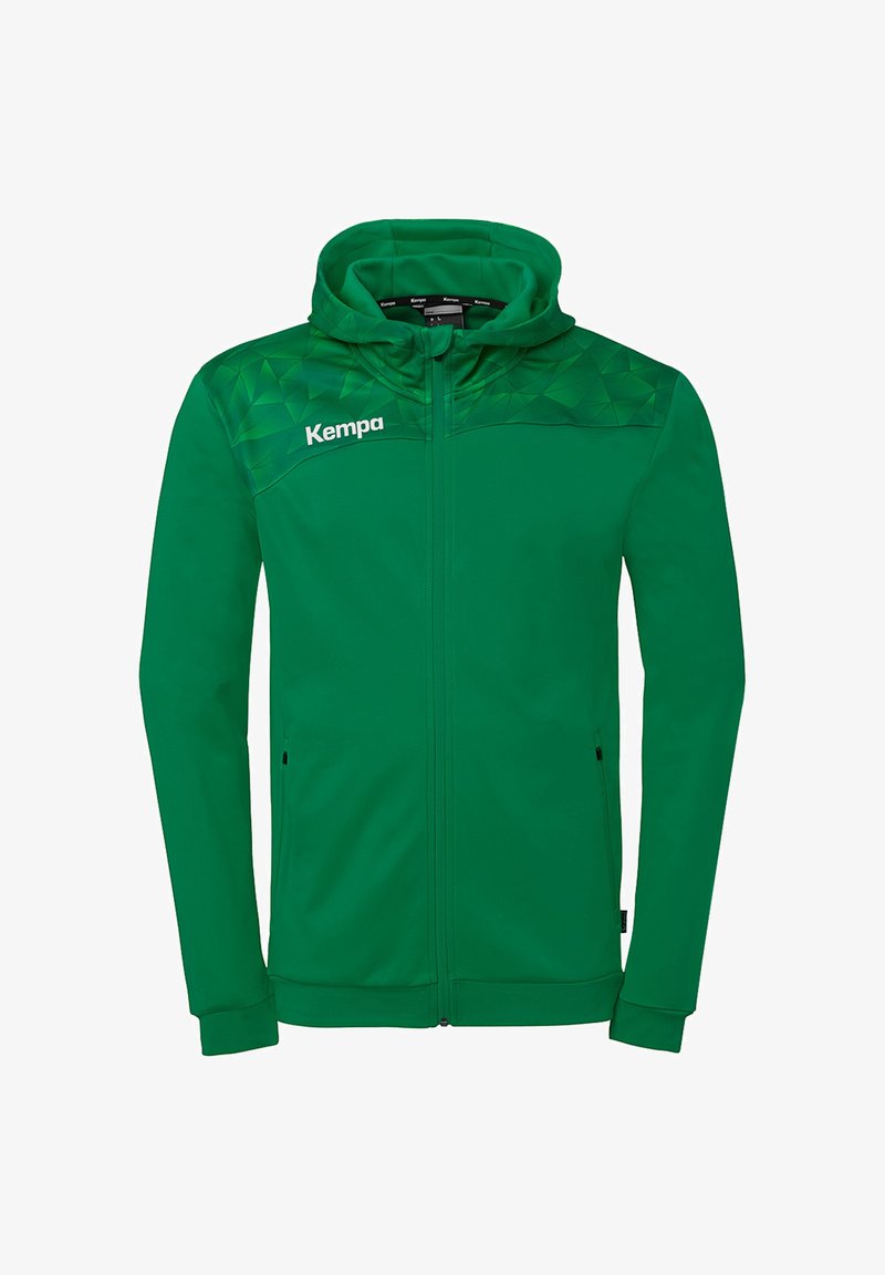 Veste à capuche verte à fermeture éclair complète avec motif géométrique sur les épaules et logo "Kempa" sur la poitrine gauche.