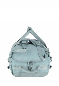Mochila acolchada de color azul claro con correas ajustables, compartimentos con cremallera y detalles de hardware en los laterales. Textura suave y diseño práctico.