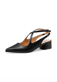 Scarpa slingback in pelle nera con punta affusolata, cinghie incrociate e tacco basso a blocco. L'interno presenta una soletta marrone.