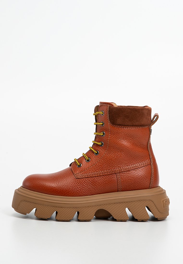 High-top brown leather boots with a textured finish, yellow laces, and a thick, rugged brown sole. Features a suede collar and side zipper.