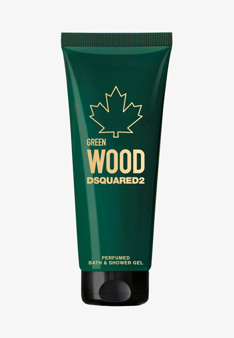 Tubo verde scuro con base nera, con testo dorato. Grafica distintiva di una foglia d'acero. L'etichetta indica "Gel doccia e bagno profumato Green Wood."