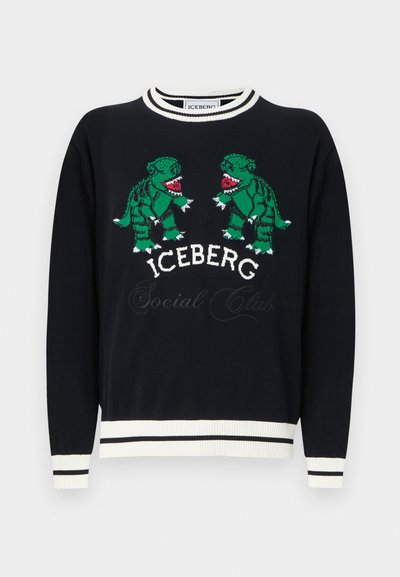 Μαύρο πουλόβερ με λευκή επένδυση που απεικονίζει δύο πράσινους δεινόσαυρους να κοιτάζονται μεταξύ τους πάνω από το κείμενο "ICEBERG Social Club" στο στήθος.