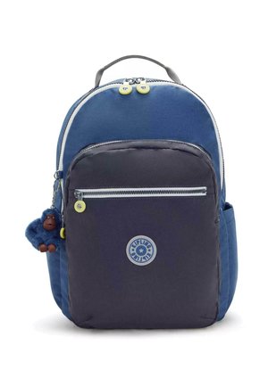 Blue and dark gray backpack with a rounded design, fabric texture, front zip pocket, and a monkey keychain accessory.