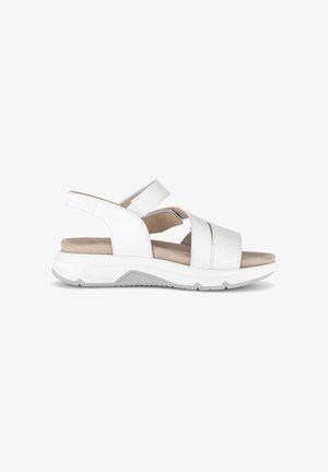 Witte leren sandaal met open teen, verstelbare enkel- en voorbandjes, gevoerde beige voetbed en dikke witte zool met grijze profielrubber.