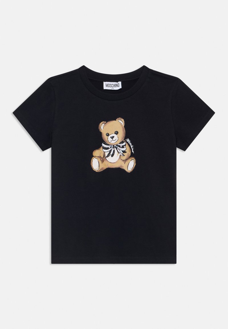 Melna kokvilnas T-kreklā ar drukātu lācīša dizainu un svītrainu tauriņu. Īsas piedurknes un apaļais kakls piešķir brīvā stila izskatu.