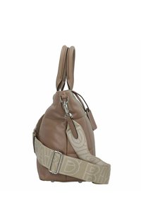 Tan leather handbag with a quilted texture, dual handles, and a detachable patterned strap. Silver hardware accents and flat base.