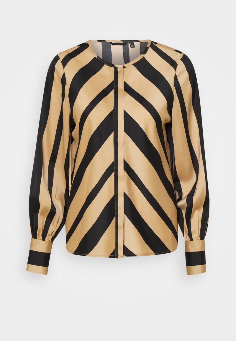 Blouse à manches longues avec des rayures diagonales beige et noires formant des motifs en chevrons, col rond et manches avec poignets.