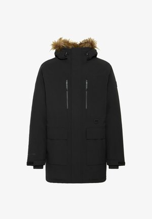 Zwarte parka met een verwijderbare met bont gevoerde capuchon, voorzien van twee borstzakken en twee voorzakken. Inclusief ritssluitingen en verstelbare manchetten.