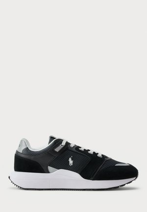 Black and white low-top sneaker with mesh and suede upper, white laces, white sole, and a polo player logo on the side.