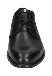 Schwarze Lederschuhe mit glatter Oberfläche, runder Schuhspitze und Schnürdesign. Mit einer gestickten Detail entlang der Sohle.