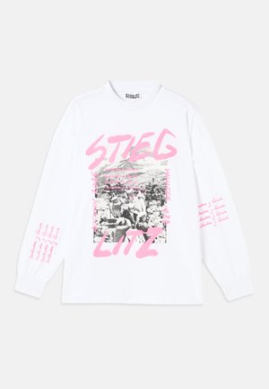 White long-sleeve t-shirt with a graphic print featuring black and white imagery and pink text, including "STIEGLITZ" and repeating phrases on the sleeves.