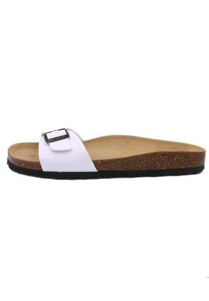 Sandale blanche à enfiler avec une boucle noire, semelle en liège et semelle extérieure noire texturée. Matériau supérieur lisse, design de semelle intérieure ergonomique.