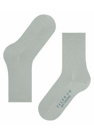 Chaussettes basses vert clair en matériau doux, avec une texture lisse et un bout sans couture. Marque et taille imprimées en bleu sous la chaussure.