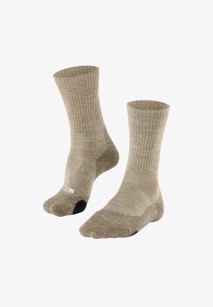 Beige gerippte Socken mit verstärkter schwarzer Ferse, angenehme mittlere Wadenlänge und glatte Textur. Geeignet für Freizeit- oder Aktivkleidung.