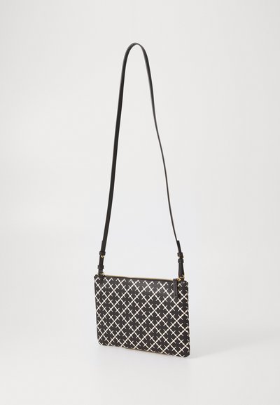 Black and white crosshatch patterned clutch bag with a zipper closure, featuring a slender adjustable strap and smooth texture.