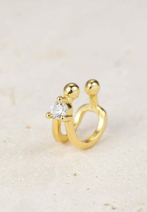 Goldring mit einzigartigem offengelegtem Design, das einen runden klaren Edelstein an der Vorderseite und abgerundete Akzente an den Seiten aufweist.